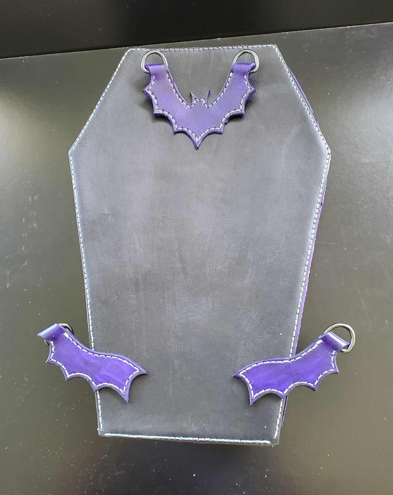 Coffin backpack front, held up